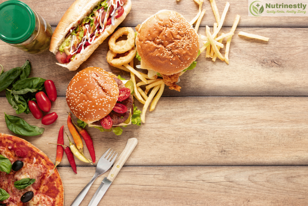fast food and some seasonings, utensils on a wood table